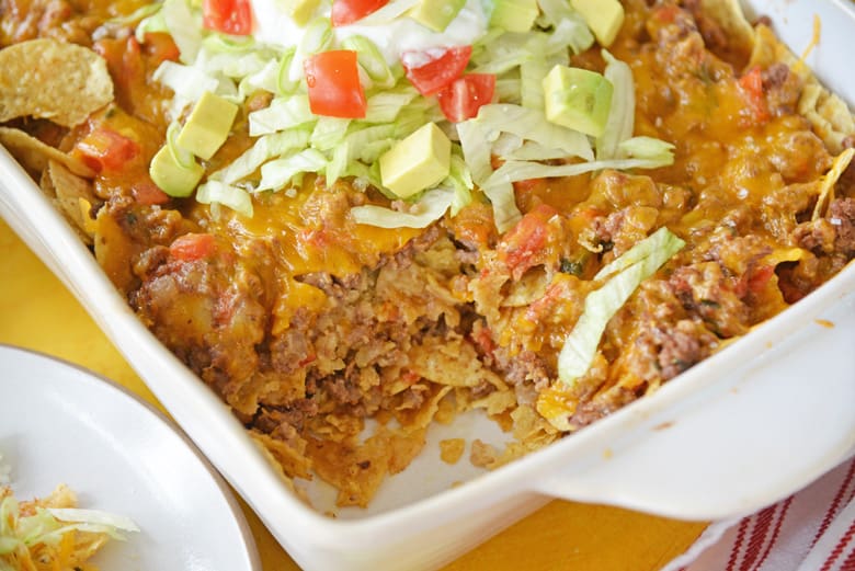 spooned out portion of taco bake casserole in serving dish 