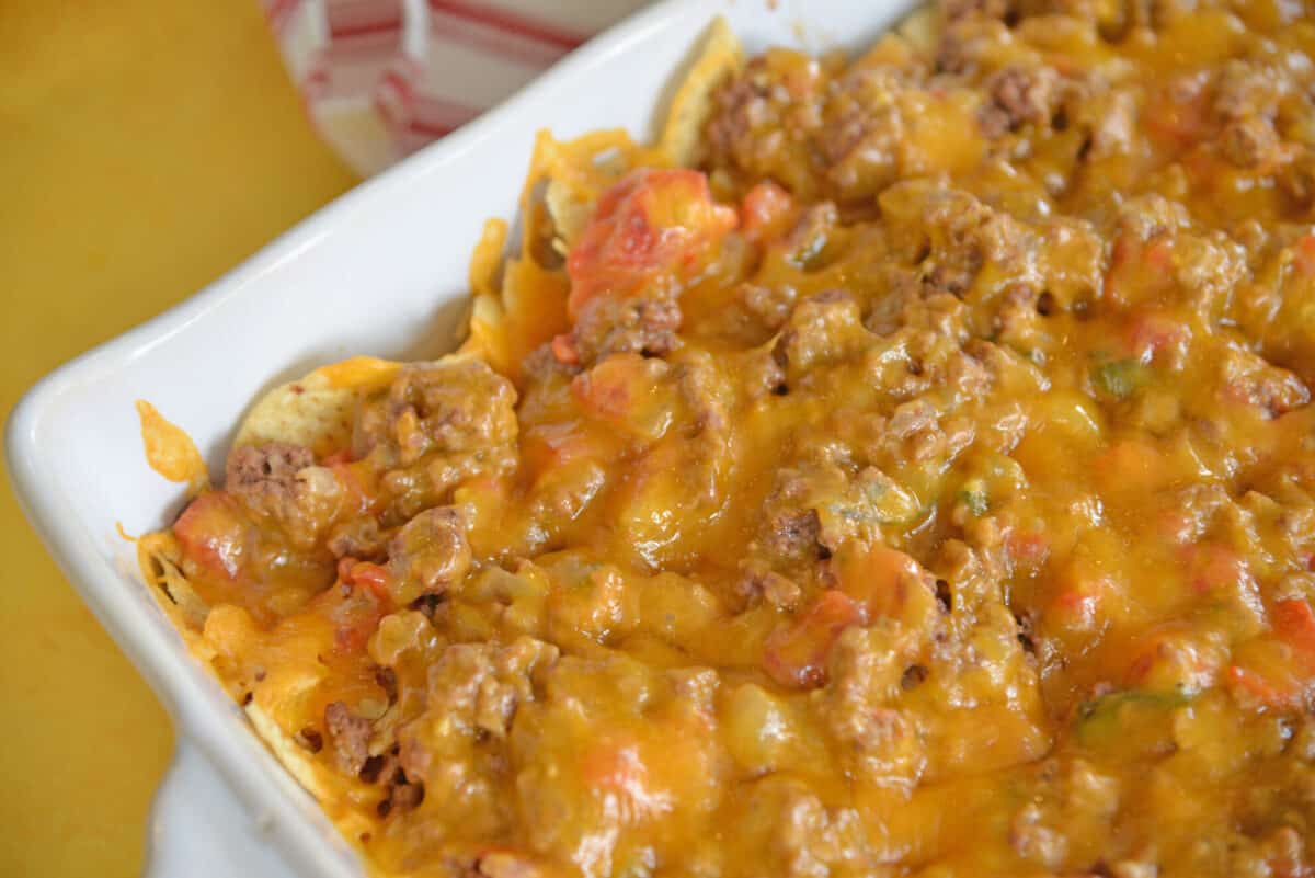 corner of a taco bake casserole with cheddar cheese 