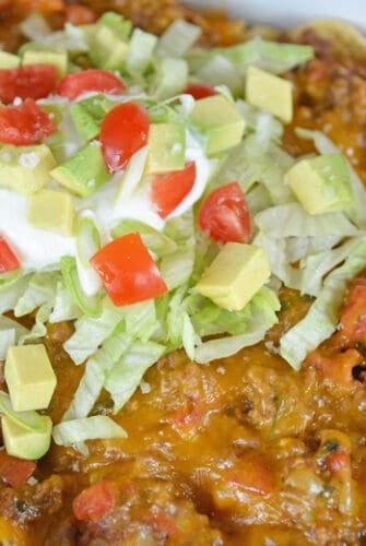 close up of taco bake with cheese and lettuce