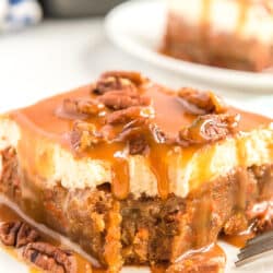 slice of caramel carrot poke cake