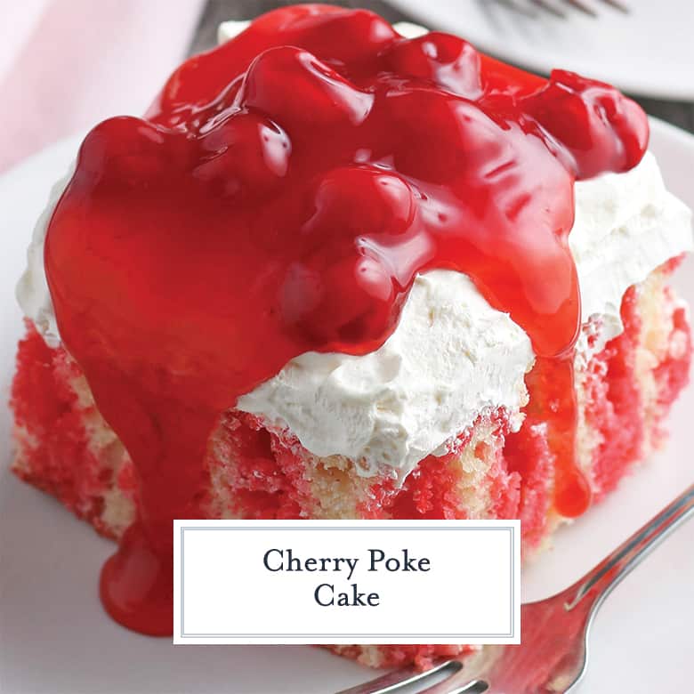 Square slice of cherry poke cake with cherry topping 