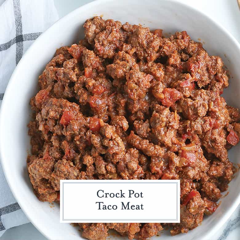 crockpot taco meat in a white serving bowl with salsa