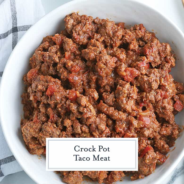 crockpot taco meat in a white serving bowl with salsa 