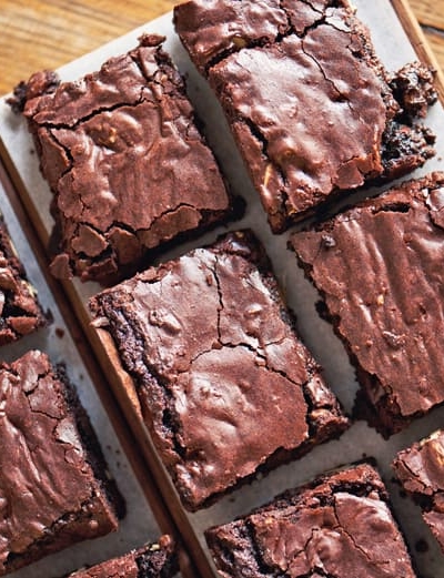 sliced brownies on parchment paper