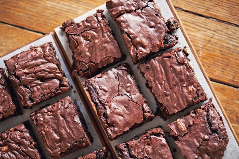 sliced brownies on parchment paper 