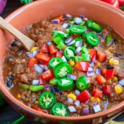 lentil chili in a bowl with peppers