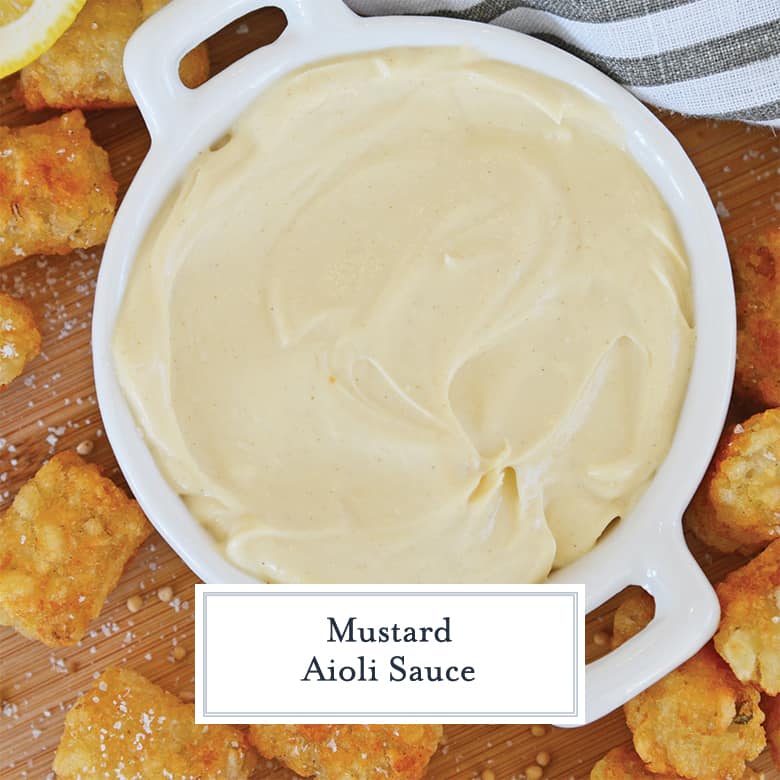 overhead of creamy mustard aioli sauce with tater tots  