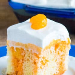 slice of orange creamsicle poke cake