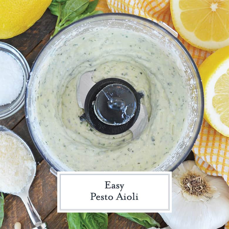 Pesto mayo in a food processor surrounded by ingredients 