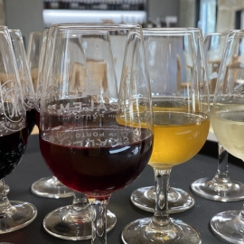 A glass filled with wine glasses