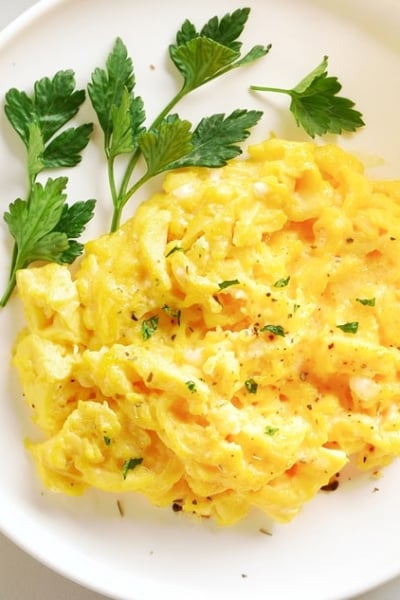 white plate with scrambled eggs