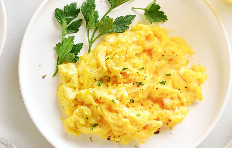 white plate with scrambled eggs