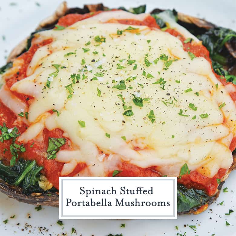 Close up of spinach stuffed mushrooms with tomato sauce and cheese