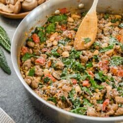 sausage, mushrooms and kale in a pan