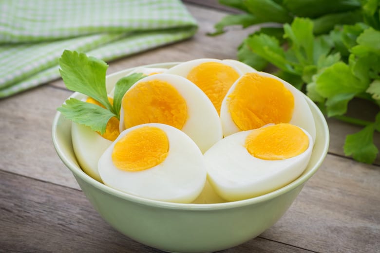 bowl of halved air fryer hard boiled eggs