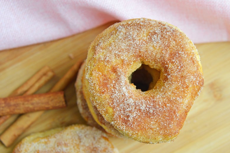 Overhead of easy air fryer donuts with cinnamon sticks 