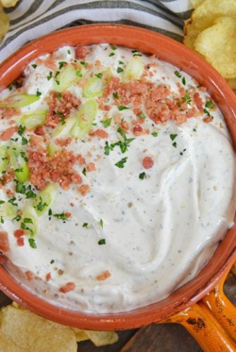 bowl of bacon ranch dip with scallions and potato chips