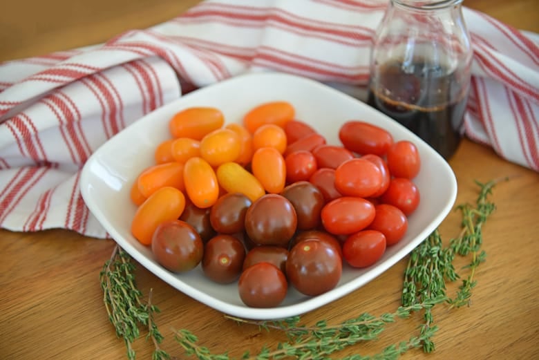 ingredients for balsamic stewed tomatoes - grape tomatoes, balsamic vinegar, fresh thyme 