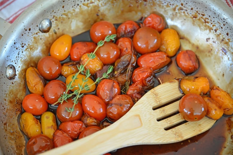 tomatoes cooking in a skillet 