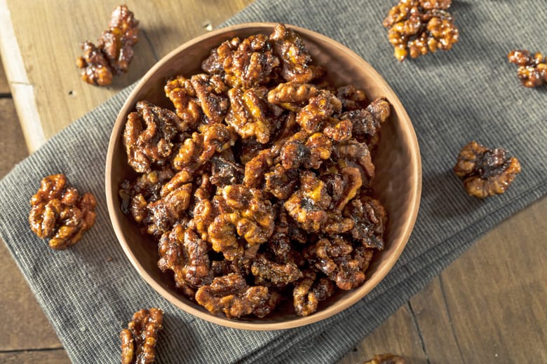 candied walnuts in a wood bowl 