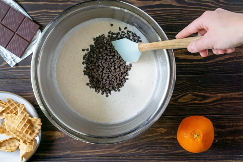 Adding chocolate chips into cannoli dip 