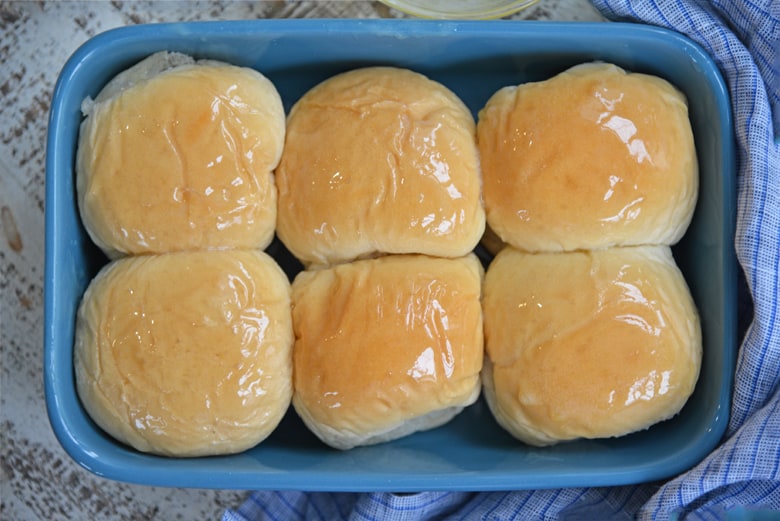 overhead close up of easy yeast rolls in a blue baking dish 