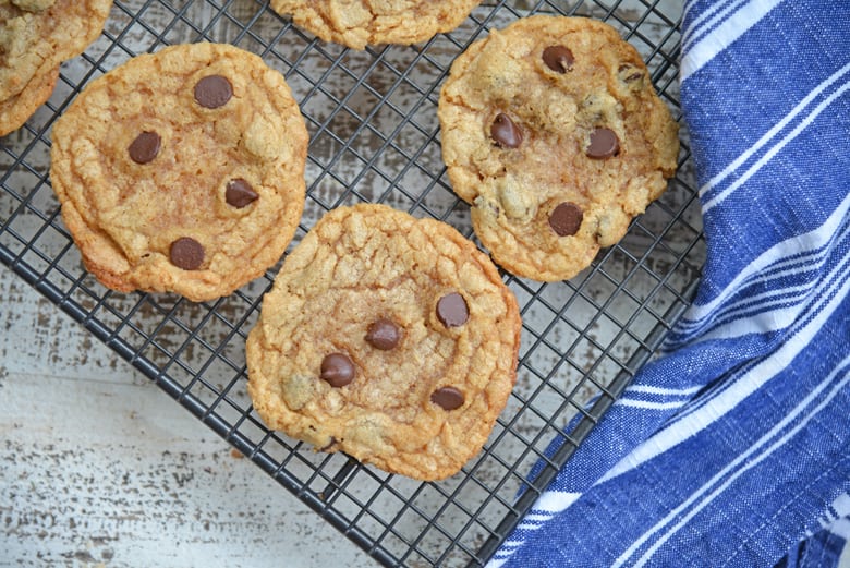 flourless peanut butter cookies with chocolate chips on a cooling rack 