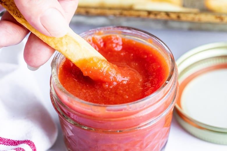 french fry dipping into ketchup 