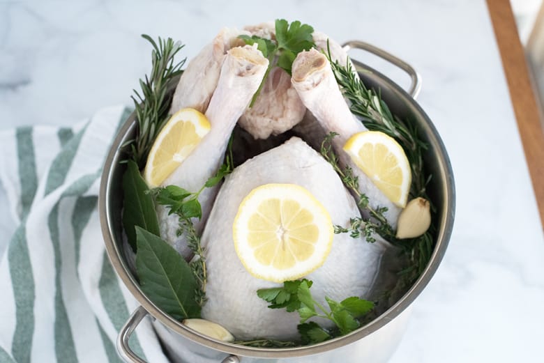 turkey in a stock pot of honey herb brine 