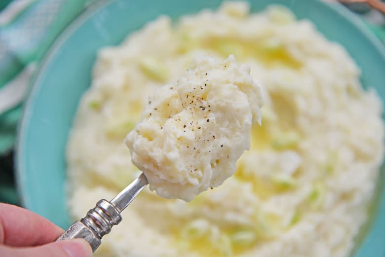 spoon of fluffy homemade mashed potatoes 