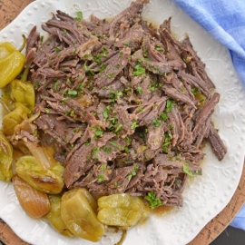mississippi pot roast on a white serving platter