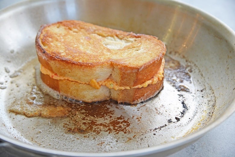 pimento grilled cheese in a stainless steel skillet 