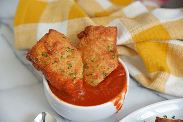 two pizza logs in dipping sauce 
