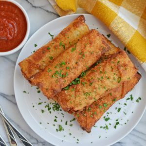 pile of pizza logs on a white plate