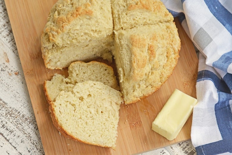 Potato bread round with a quarter cut out 