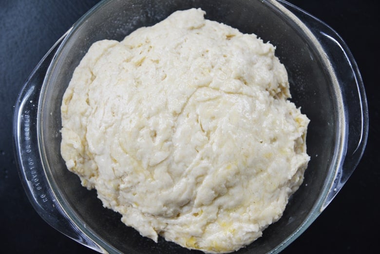 bread dough in a round baking dish 