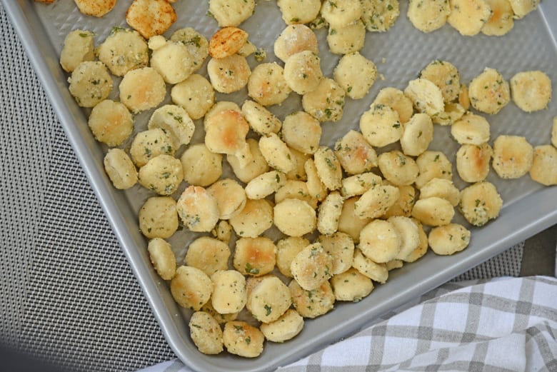 Ranch oyster crackers on a baking sheet 