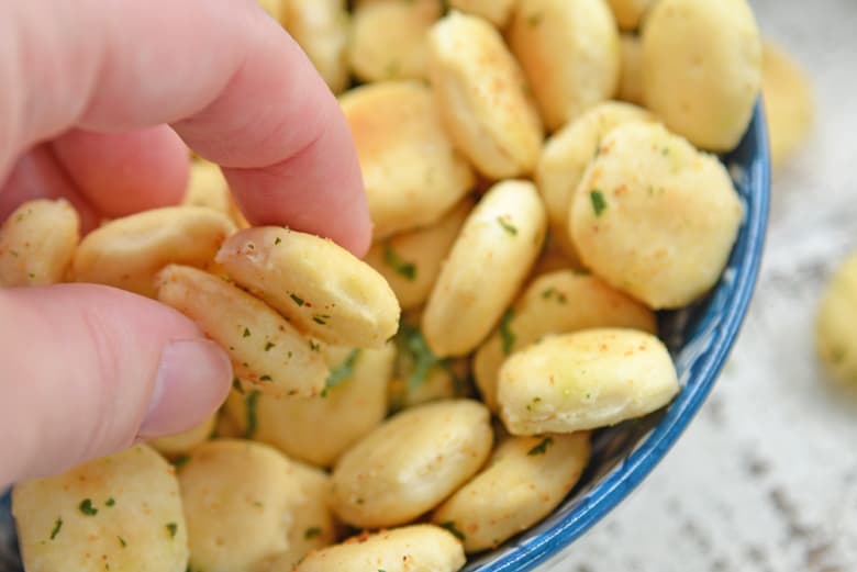 hand reaching for oyster crackers 