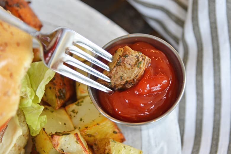 ranch potatoes dipping into ketchup 