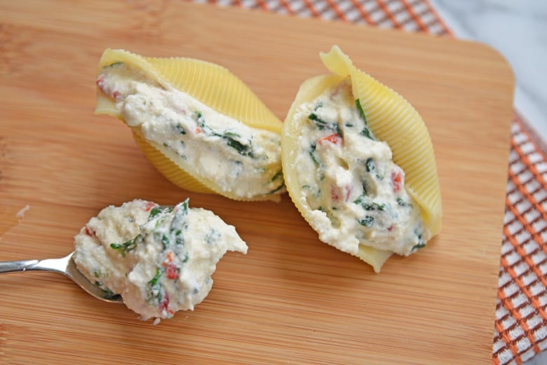 ricotta stuffed shells on a cutting board 