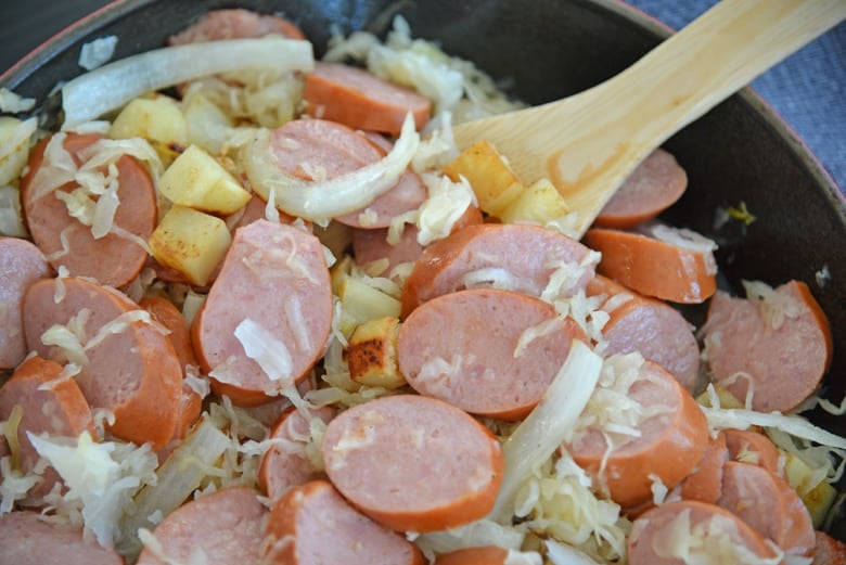 pork and sauerkraut in a skillet  