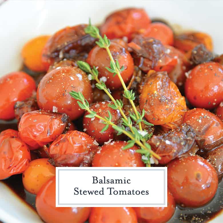 close up of stewed tomatoes with salt, pepper and fresh thyme