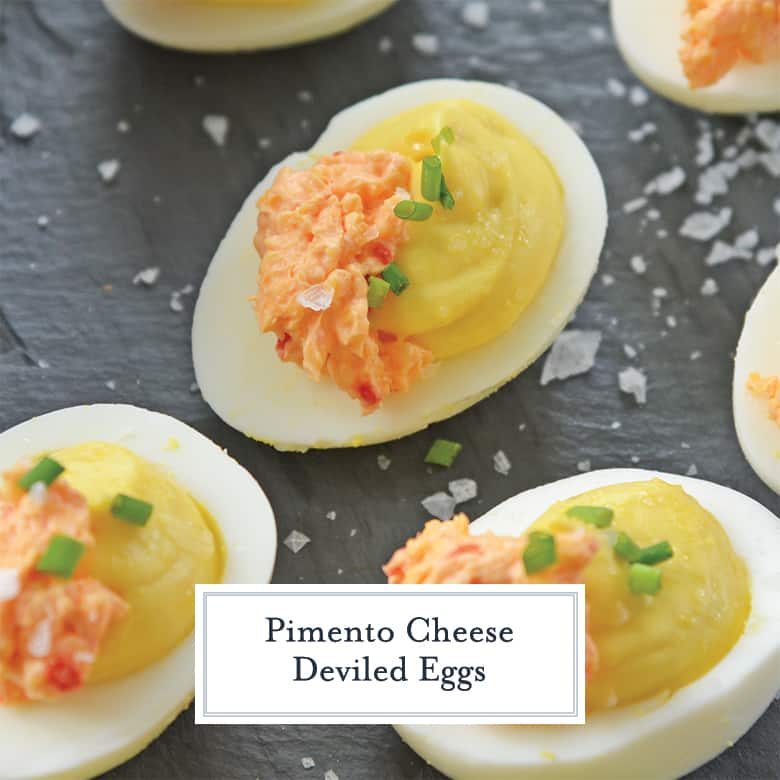 pimento cheese deviled eggs on a slate serving board 