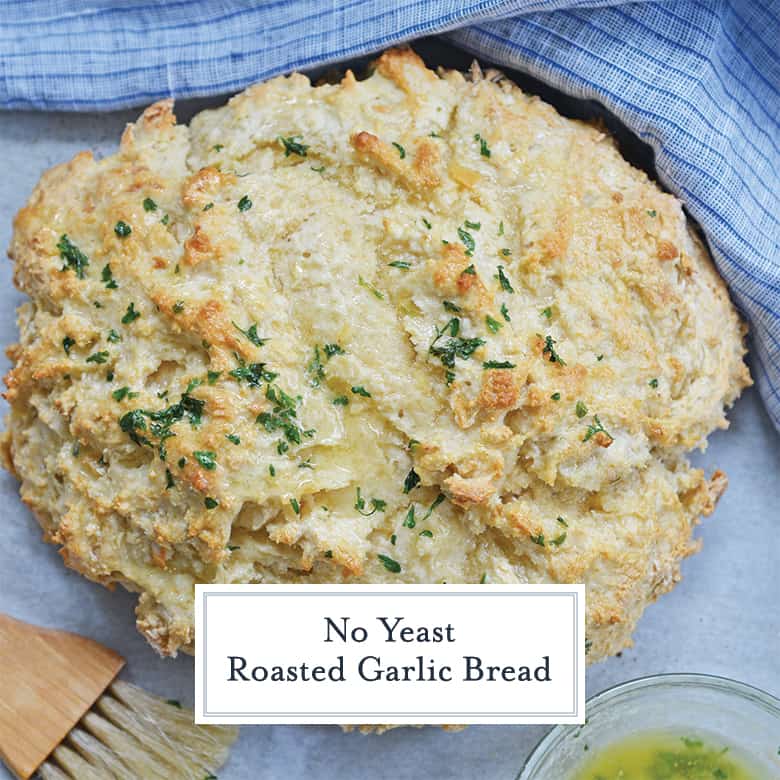 round loaf of no yeast roasted garlic bread with butter topping