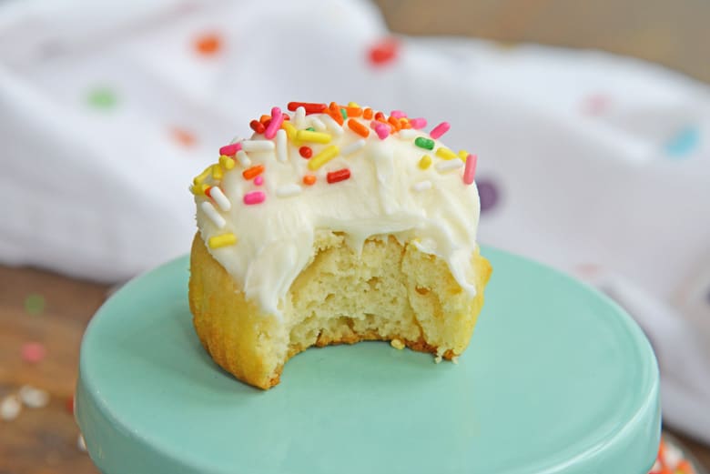 vanilla cupcake with a bite missing 