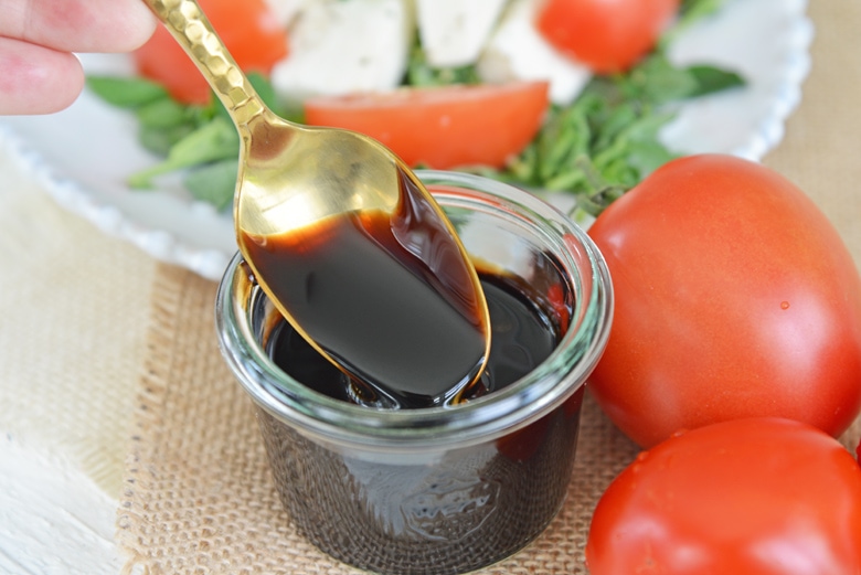 gold spoon in balsamic vinegar