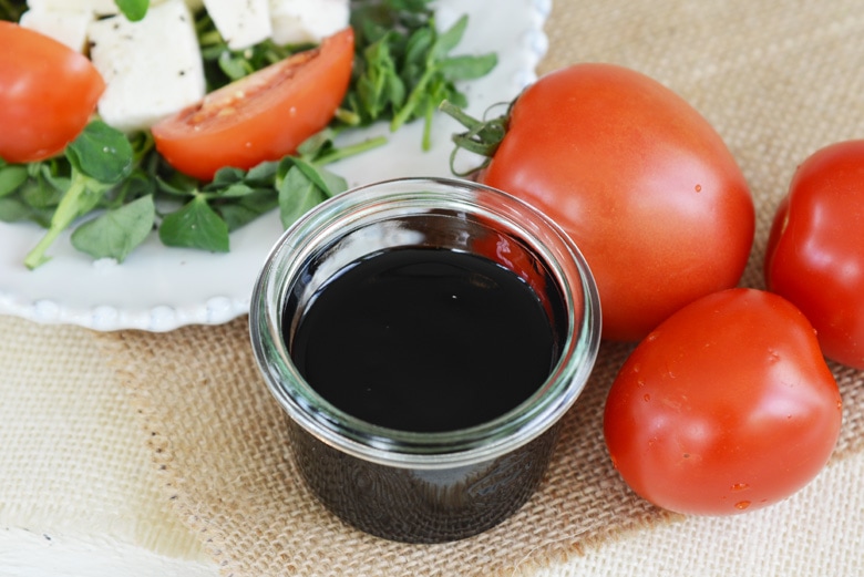 angle view of balsamic reduction with fresh tomatoes 