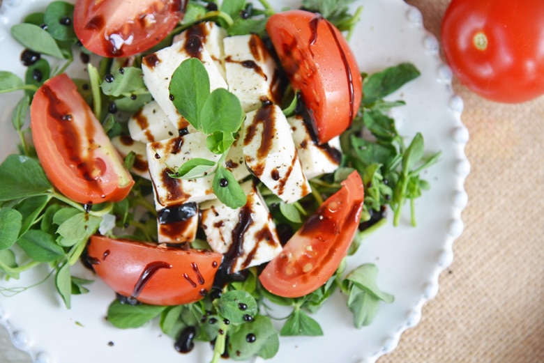 balsamic reduction drizzled on caprese salad 