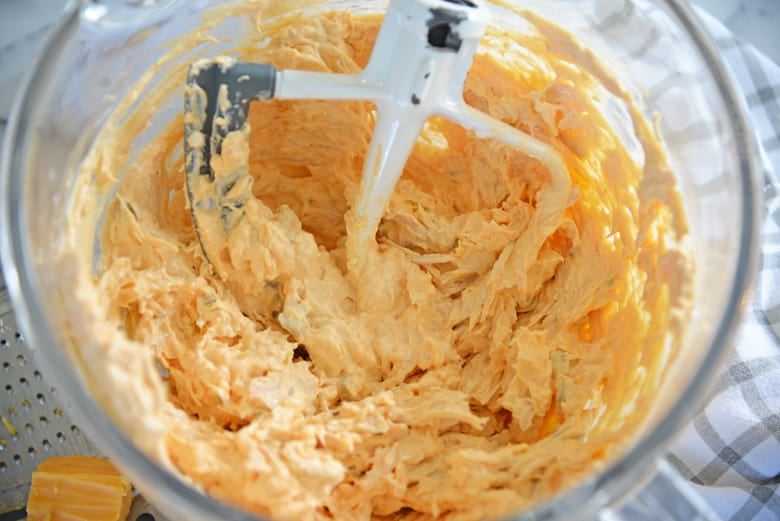 buffalo chicken dip in a glass mixing bowl