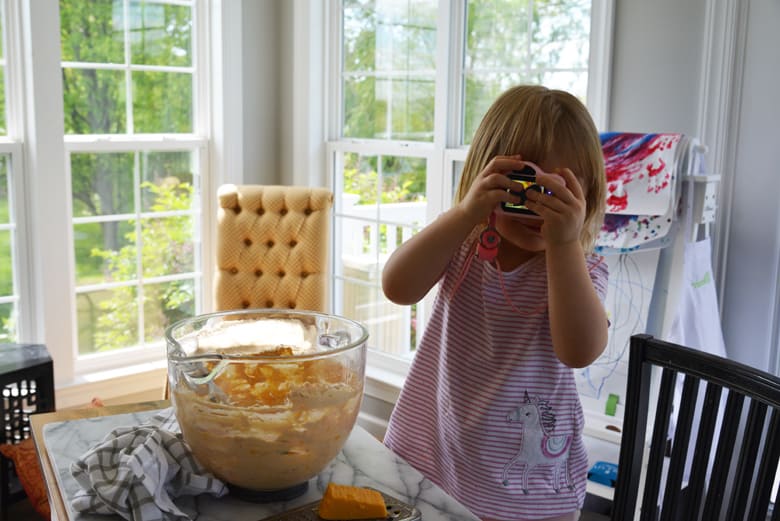 little girl taking a picture